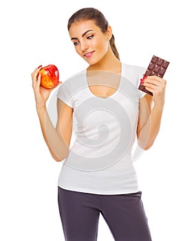 Young girl with apple and chocolate