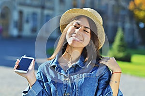 A young girl of Asian appearance enjoys life and listens to music