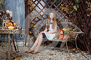 Young girl in autumn fairy garden. Fall