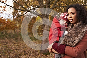 Young Girl On Autumn Walk With Mother