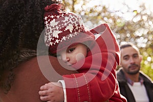 Young Girl On Autumn Walk With Parents