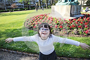 Young girl on the background of flowers field