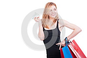 Young girl with bags and bunch of money