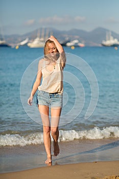 Young girl on the beach in Cannes