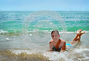 Young girl in the beach sea waves