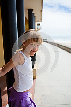 Young girl on beachside walkway photo