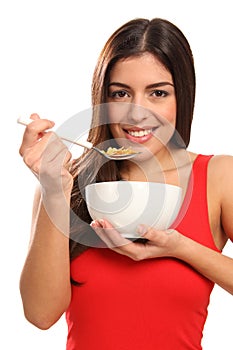 Young girl beautiful smile eating breakfast cereal