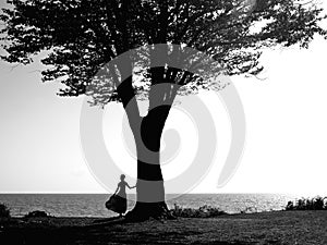 Young girl with a beautiful tree