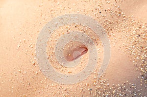 Young Girl Bellybutton Covered In Beach Sand