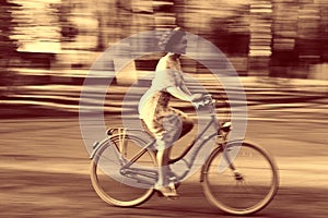 Young girl on bike in movement