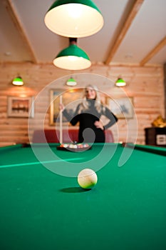 Young girl with billiard balls