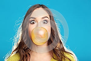 Young girl blowing bubble