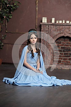 Young girl in blue vintage dress late 19th century