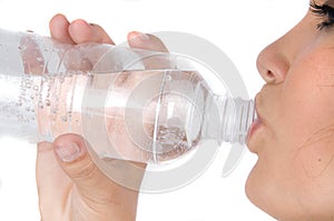 Young girl with bottle of mineral water