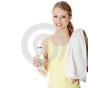 Young girl with bottle of mineral water