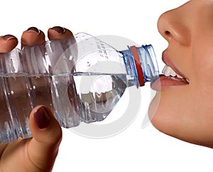 Young girl with bottle of mineral water