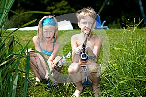 Young girl and boy fishing