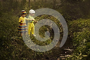 Young girl and boy fishing