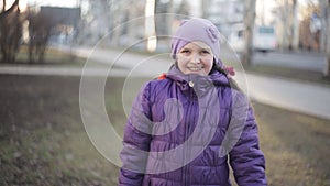 Young girl in braces cute smiling in the spring park