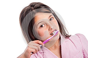 Young Girl Brushing Teeth. photo