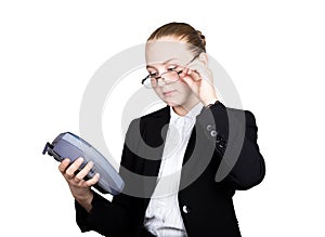 Young girl in a business suit, offers e-card to pay for purchases