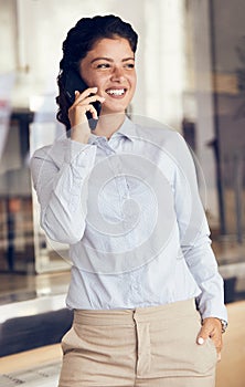 Young girl businesswoman talking on a cell phone mobile