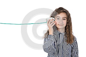 Young girl call by tin can phone isolated on white