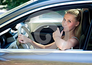 Young girl in car with car key