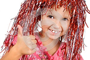 Young girl with carnival wig showing thumb up