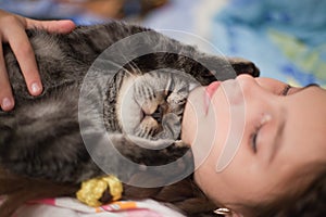 Young Girl and Cat Taking a Nap