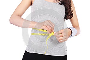 Young girl with centimeter in dieting concept