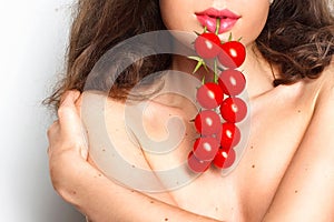 Young girl with cherry tomatoes
