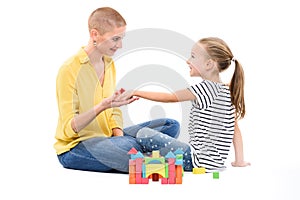 Young girl in child occupational therapy session doing sensory playful exercises with her therapist. Child therapy concept.