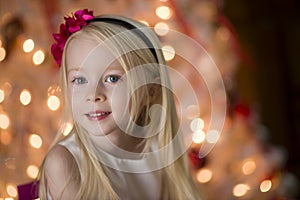 Young girl By Christmas tree