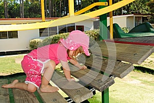 Young girl climbing on playground