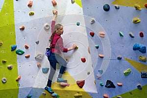 Young girl on a climbing wall