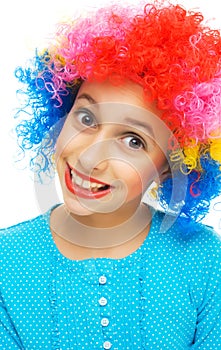 Young girl with colorful party wig