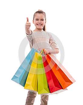 Young girl with colorful shopping bags