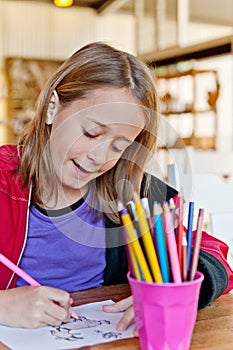 Young girl, colouring `