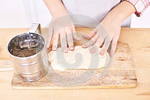 Young girl cooking at kitchen. Curly pretty child portrait. Chef student