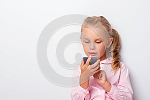 Young girl counting a calculator