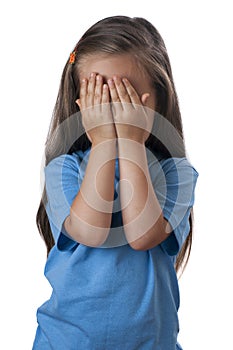 Young girl covering her face over.