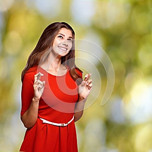 Young girl cross fingers. Hope female gesture. Job or study problem. Smile woman portrait. Hand language