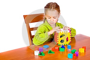 Young girl with cube