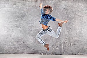 Young girl dancing, jumping.