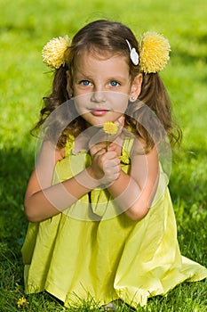 Young girl with dandelion