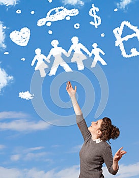 Young girl daydreaming with family and household clouds