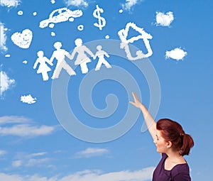 Young girl daydreaming with family and household clouds