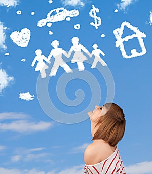 Young girl daydreaming with family and household clouds