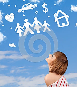 Young girl daydreaming with family and household clouds